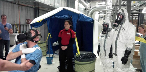 trainees with personal protective apparel in training session